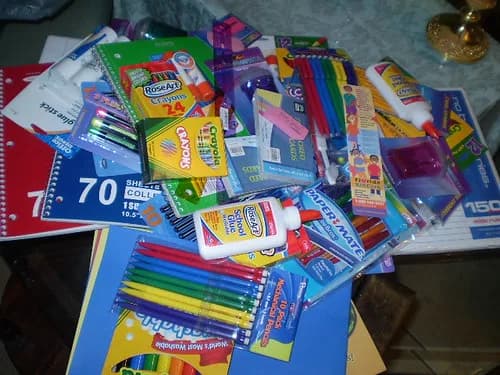 Notebooks, pens and school supplies on a desk — Back to School on a Budget 2026: Complete USA Family Guide