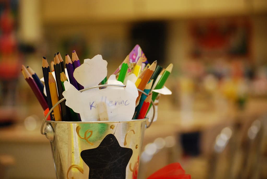 Notebooks, pens and school supplies on a desk — Back to School Shopping List 2026: Everything Your Kid Needs Under $100